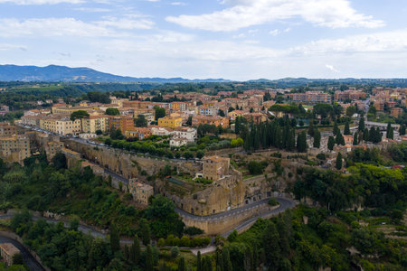 Pitigliano's aerial skyline with views of its ancient Etruscan roots with tuff stone architecture nestled on steep cliffs.の写真素材
