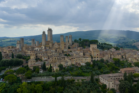 Aerial view of San Gimignanoâs medieval stone towers rising above Tuscan hills, a former 13thâcentury trading center and UNESCO site.の写真素材