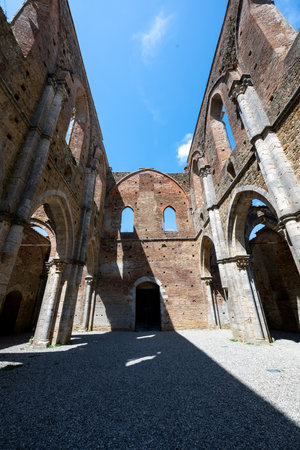 Gothic nave ruins of the 13thâcentury Cistercian Abbazia di San Galgano near Chiusdino, stone arches open to the sky.の写真素材