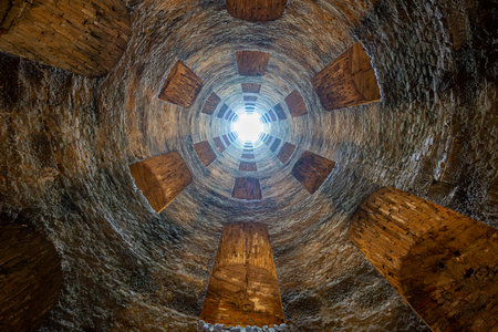 St. Patrick's Well, Orvieto, Italy, built in the 16th century, features helical staircases and tuff...