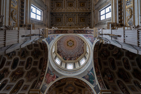 Mantua, Italy - Jul 25, 2025: Upward view of the dome and coffered nave ceiling of Mantuaâ€™s...