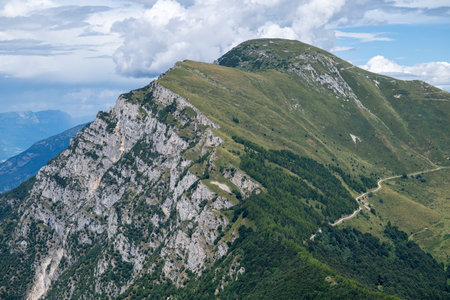 Summer view of Mount Baldoâs limestone ridge and alpine pastures above Lake Garda, popular for hiking and biodiversity research.の写真素材