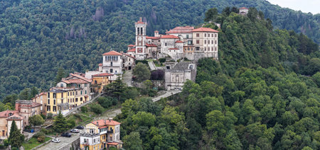 Aerial view of Sacro Monte di Varese, UNESCO-listed Catholic sanctuary complex rising above forested slopes in the Prealps.の写真素材