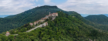 Aerial view of Sacro Monte di Varese, UNESCO-listed sanctuary village and Baroque chapels set on a forested prealpine ridge.の写真素材