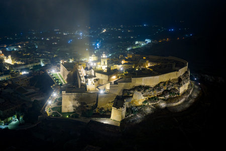 Night aerial view of the illuminated Cittadella fortifications in Victoria (Rabat), Gozo, with...