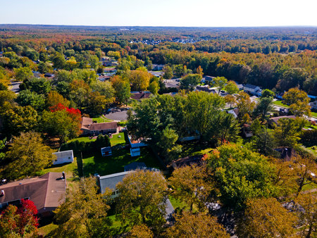 Aerial view of Autumn foliage colors in a section of the town of Old Bridge, in New Jerseyの写真素材
