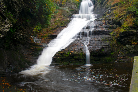 Direct view of Dingmans Falls in Dingmans Ferry, PA, on a mid-autumn afternoon with blur caused by long exposure -01の写真素材