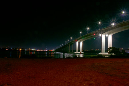 Victory Bridge over the Raritan River at Perth Amboy, New Jersey, at night, with the roadway lights and bridge supports illuminated -05の写真素材