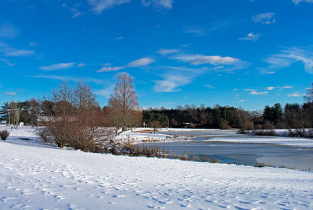 Pond in Bucks Mill Recreational area in Colt's Neck, New Jersey, on a cold, crisp, winter day, after some snowfall -03の写真素材