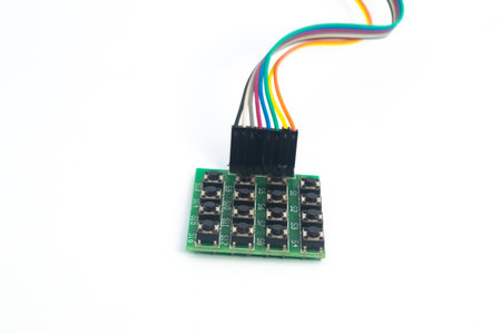 A 4x4 keypad module with a rainbow cable behind it. This module is used for electronics hobbyists...