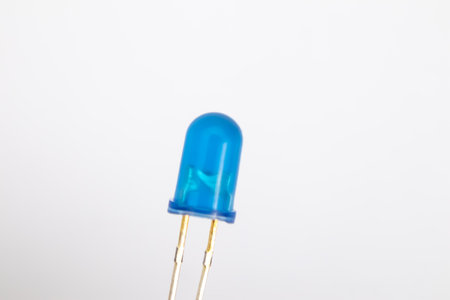 A blue LED on a white background. This part is used for DIY electronics for hobbyists.の写真素材
