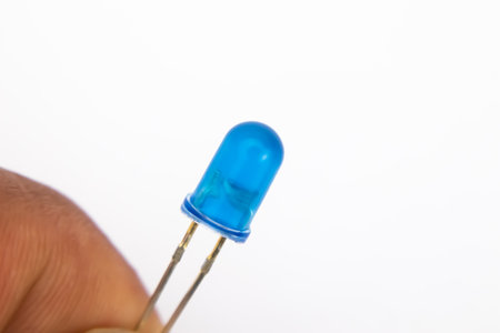 A hand held blue LED on a white background. This part is used for electronics DIY.