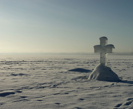 Ice cross at an ice-hole on the Christening. Coast of Onega. Kareliya, the north of Russia  の写真素材