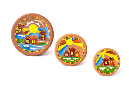 Decorative plates, covered by a list. Over whiteの写真素材