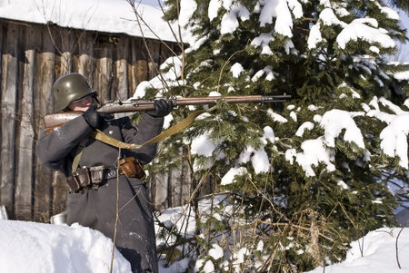 Soviet-Finnish war 1939-1940: Finnish soldier aims from a rifleの写真素材