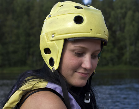 Rafting in KareliaGirl in a protective helmet and a life jacketの写真素材