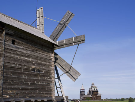 Karelia. Kizhi Island. A windmill and Preobrazhenskiy churchの写真素材