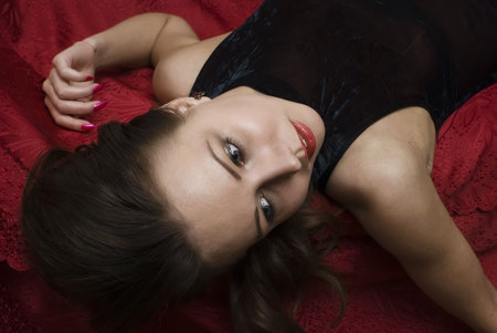 Dead woman lying on the sofa. Studio shot.の写真素材