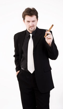 Business man in black suit with cigarの写真素材