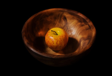 Picture of a still-life with apple in a wooden dishの写真素材