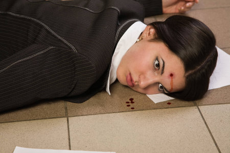 Face of the lifeless killed businesswoman in a officeの写真素材