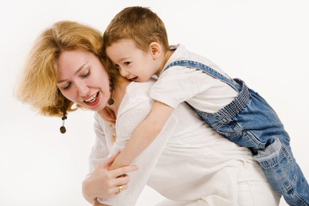 Mother and her little son play togetherの写真素材