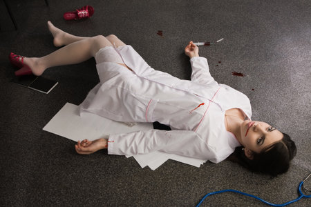 Crime scene. Nurse lying on the floor

の写真素材