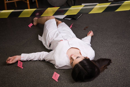 Crime scene. Dead nurse lying on the floorの写真素材