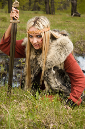 Viking girl warrior with sword fightedの写真素材