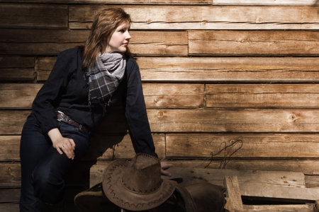 Portrait of the young cowgirl on a ranchの写真素材