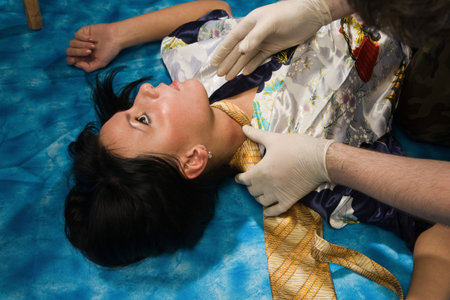 Forensic expert collecting evidence in a crime scene around a strangled woman