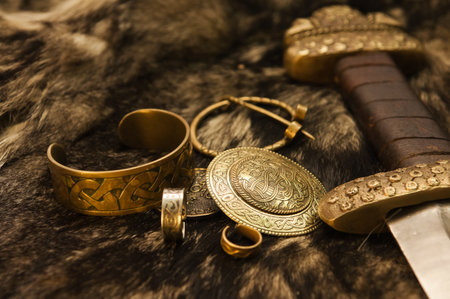 Still life with ancient scandinavian jewels and sword on a fur の写真素材