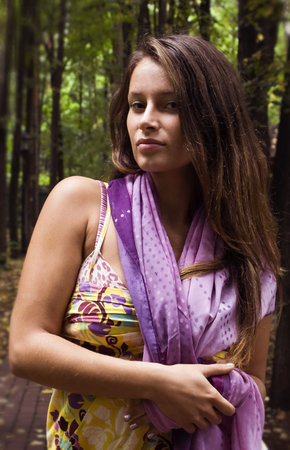 The young beautiful girl on walk in autumn park