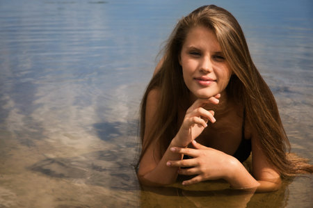 Attractive girl in a bikini on a sandy beachの写真素材