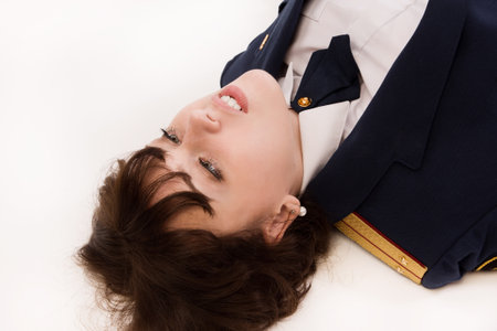 Crime scene imitation. Woman officer lying on a floorの写真素材