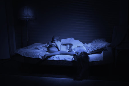 Pretty sensual girl sleeping in the bedroomの写真素材