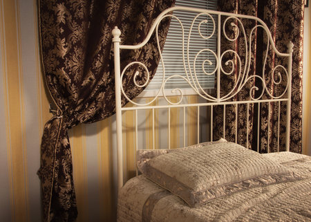Old style bed in the elegant bedroomの写真素材