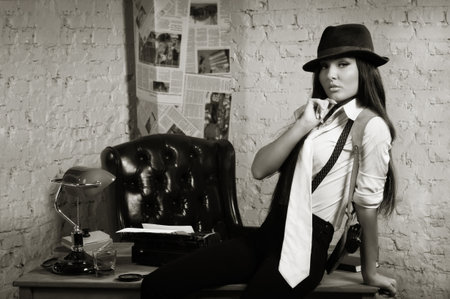 Retro detective girl in the detective agencyの写真素材