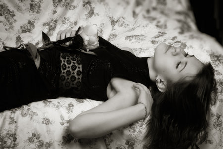 Attractive sensual brunette lying on the sofaの写真素材