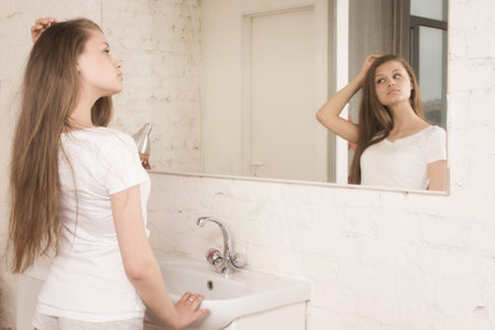 Beautiful spa girl in the bathroomの写真素材