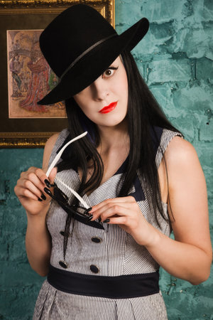 Attractive gothic model in the interior of the boudoir