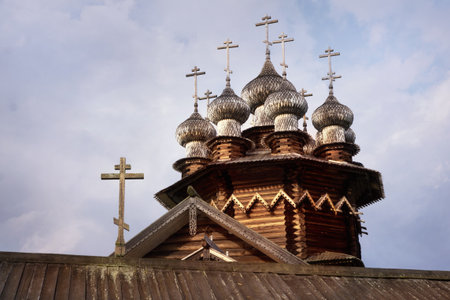 Domes of loghouse Orthodox Church in North Russian styleの写真素材