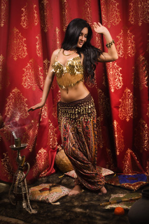 Arabic woman belly dancer dancingの写真素材