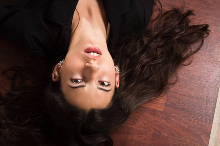 Crime scene in a office with lifeless businesswoman lying on the floorの写真素材