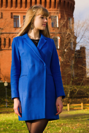 Happy blonde in autumn parkの写真素材