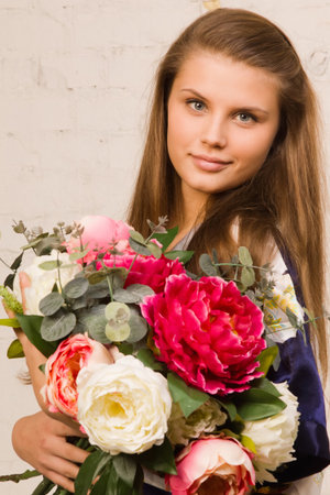 Close up portrait of the beautiful girl with flowersの写真素材
