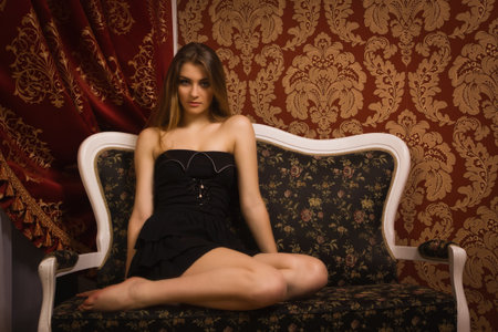 Beautiful young woman in boudoir. Retro styleの写真素材