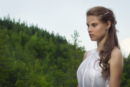 Slavonian girl in the traditional suit in the deep forest Slavonian girl in the traditional suit in the deep forest
