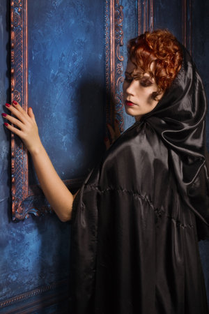 Very pretty woman vamp in the dark interiorの写真素材