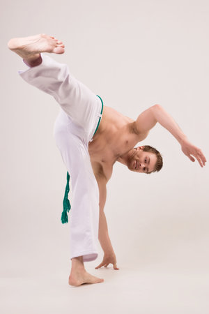 Capoeira guy making a coupの写真素材